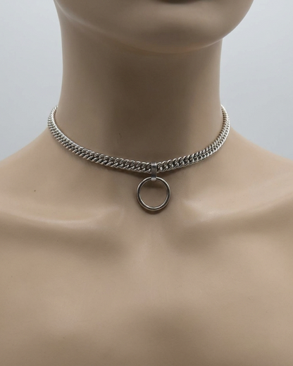Silver chain choker necklace on a mannequin neck with a plain background