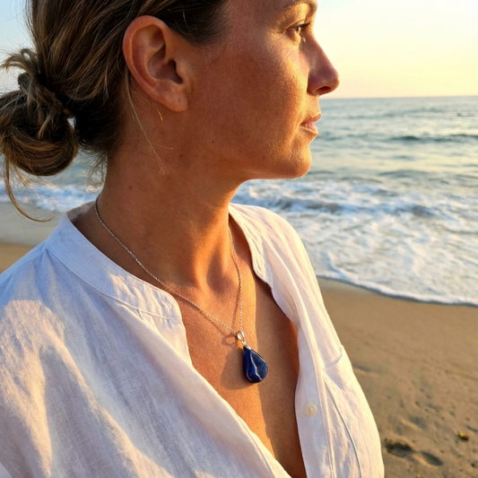 Woman on a beach with ocean view during sunset