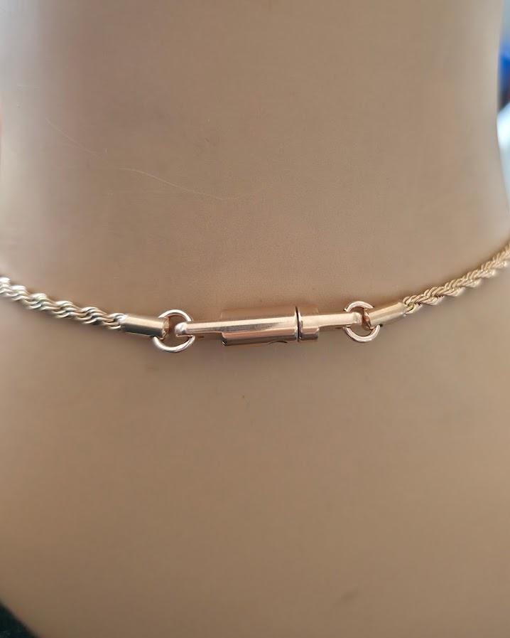 Shield Maiden™ Signature Lock & Key Clasp, a proprietary closure forged for strength, trust, and intention.