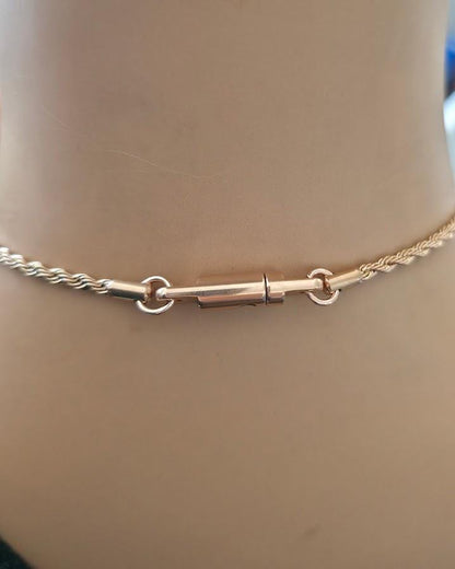 Shield Maiden™ Signature Lock & Key Clasp, a proprietary closure forged for strength, trust, and intention.